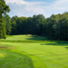 A sunny day view of a well protected hole at The Ravines Golf Club.