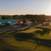 View of the 10th tee box with the clubhouse in the background at Eagle Glen Golf Course.