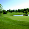 A view of the 15th green with water in background at Rustic Glen Golf Course