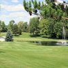 A view of red tee with water fountain on the right side at Hills Heart of the Lakes Golf Course