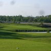 A view of green surrounded by water at Quest Golf Club