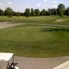 A view from the clubhouse of the putting green at Sandy Ridge Golf Course