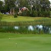 A view of the practice putting green with green in background at Bay Meadows Golf Course