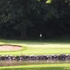 A view over the water of green #4 at Milham Park Golf Course