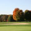 A fall view of a green guarded by bunker at Tyler Creek Golf Club