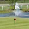 A view of a hole at Manistee National Golf & Resort with water fountain in background