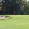 A view of the 3rd green with sand trap on the left side at Kent Country Club