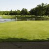 View of a green with lake and fountain in the back at Lakeview Hills Country Club & Resort