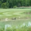 View of a hole and pond at Lake Erie Metropark Golf Course