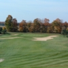 A view of a green guarded by sand traps at Timber Wolf Golf Club