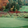 A fall view of a green with a bridge in the background at White from Mistwood Golf Course