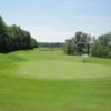 A view of a hole with a lake in background at The Woodlands Course at Whittaker