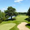 A view of a green with water and a bunker coming into play at Pohlcat Golf Club