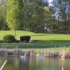 View of a green and a pond at Golden Sands Golf Course