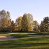 A view of a green protected by sand traps at Currie Golf Course