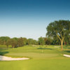 A view of a green flanked by bunkers at Country Club of Detroit