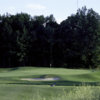 A view of a green surrounded by bunkers at The Meadows.