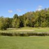 A view of green #7 surrounded by water at Interlochen Golf Club