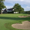 A view of a green protected by bunkers at Northport Point Golf Club