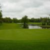 A view of a green with water coming into play at Bay Pointe Golf Club