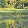 A sunny view from Huntmore Golf Club surrounded by water