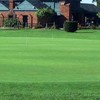 A view of the practice putting green with the clubhouse in background at Chandler Park Golf Course 