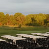 A view of the 18th green and some golf carts at The Majestic At Lake Walden Golf Course