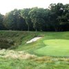 A view of the 17th hole surrounded by water at Pohlcat Golf Course