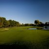 A view of green surrounded by water at Cherry Creek Golf Club