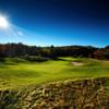 A sunny day view of a green at Manitou Passage Golf Club