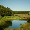 The par-3 11th hole on Treetops Resort's Fazio Premier course requires a shot over water.