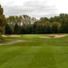 A view of the 8th green flanked by bunkers at Lake Michigan Hills Golf Club