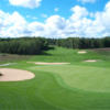 A view of a green surrounded by tricky bunkers at Heathlands Golf Course