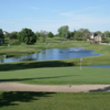 A view of a green with water coming into play at Sugar Springs Golf Course