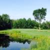 A view over the water of a hole at Munoscong Golf Club