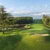 Monument's relativley short eleventh hole requires a precise shot off of the tee that not only carrys the pond in front, but avoids hazards down both the left and right hand sides.  A well bunkered green is also guarded on the front right by another pond