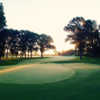 A sunrise view of a green at Moors Golf Club.