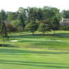 A sunny day view of a green at Forest Lake Country Club.