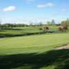 A sunny day view of a green at Bird Creek Golf Club.
