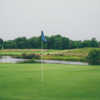 A view of a green with water in background at Railside Golf Club.
