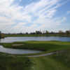 A view of a green surrounded by water at Greystone Golf Club.