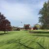 A view from a fairway and the clubhouse in background at Manistee Golf & Country Club.