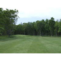 The par-5 16th plays along the back of the course through woods.