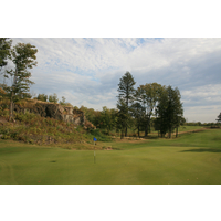 One of many rock walls lie next to Greywalls Golf Course's eighth green. 