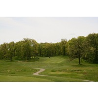 Leslie Park Golf Course's par-5 11th hole plays through trees. 