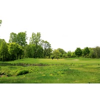 The Orchards Golf Club's par-3 second hole plays over wetlands.