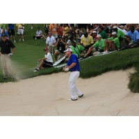Tom Watson hits a bunker shot on the par-5 fifth hole during the Champions for Change event at Harbor Shores. 