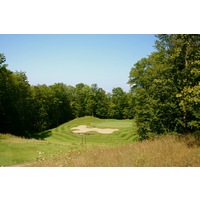The par-3 17th hole on the Legend golf course at Shanty Creek Resorts plays 190 yards downhill. 