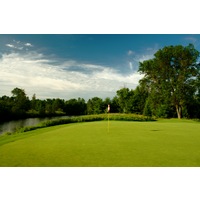 The first hole on the Swampfire Course at Garland Resort and Lodge is a par 4 with water behind the green.