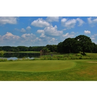 Thoroughbred Golf Club's 15th hole plays along a lake.